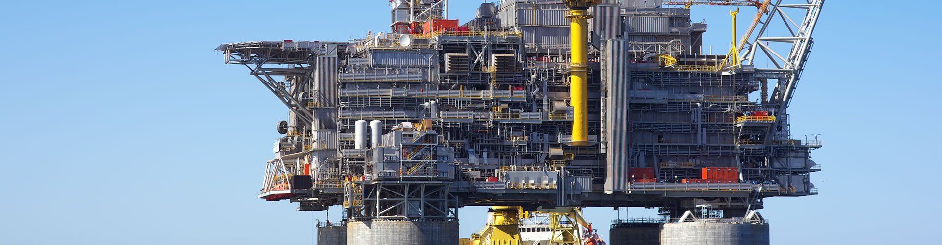 A large oil platform with a crane on top